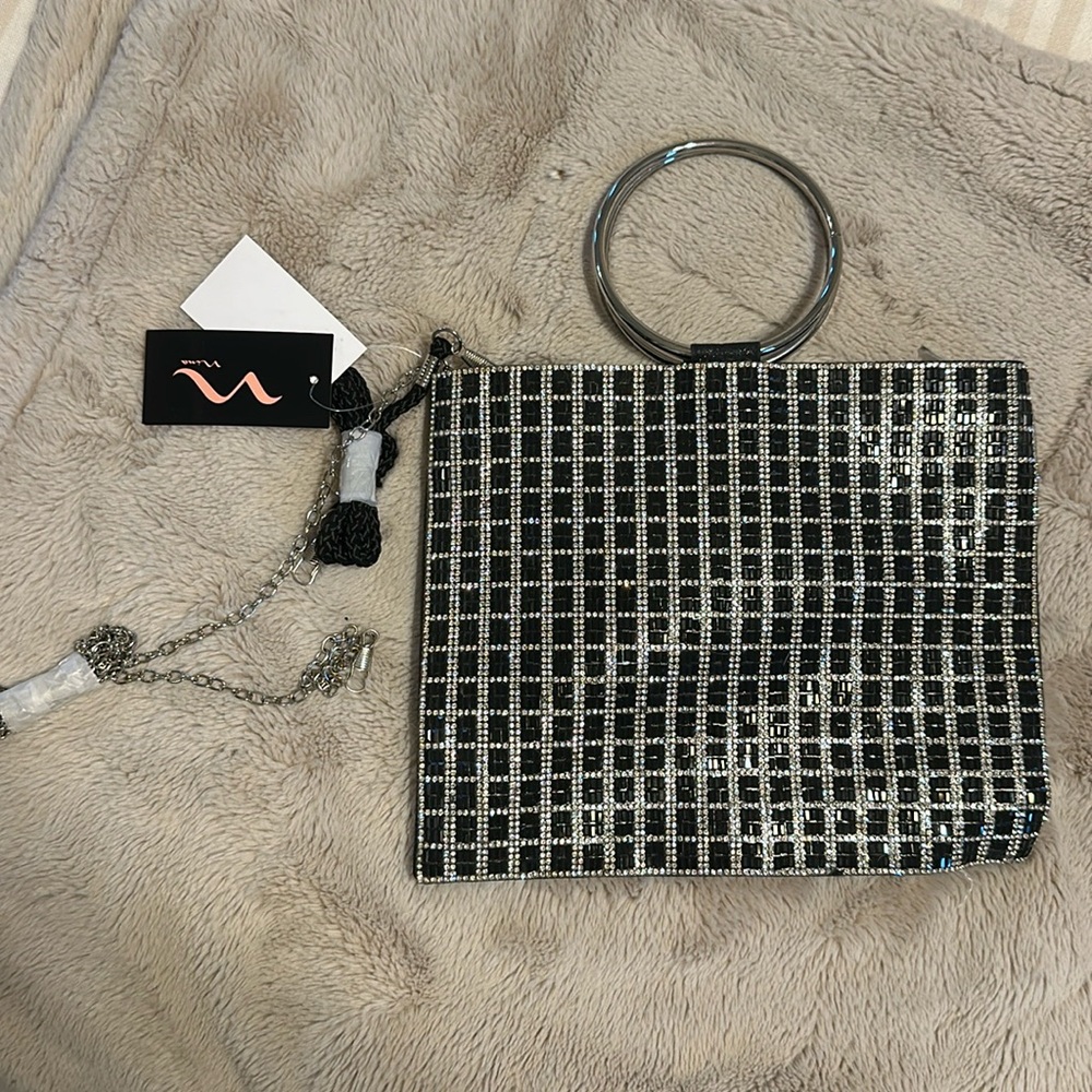 Work once. Great condition. Brand: Nina. Silver and Black diamond bag.